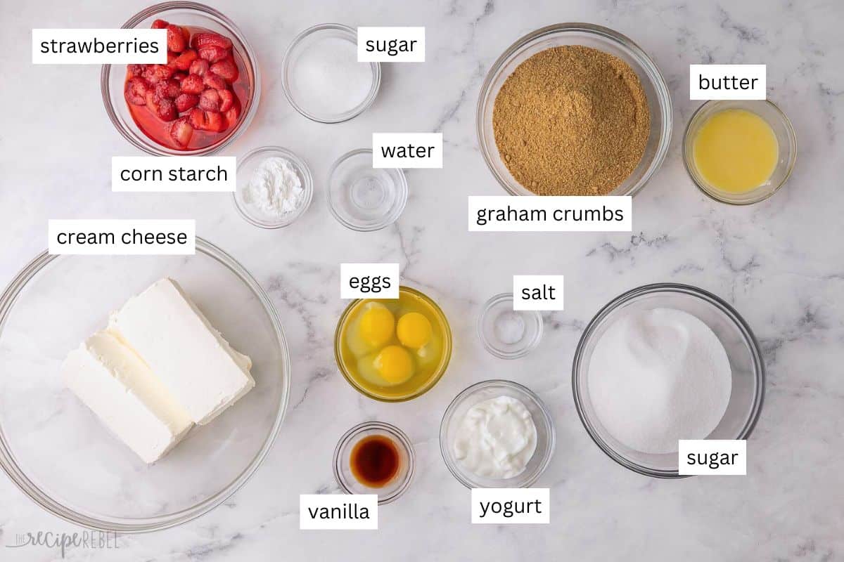 ingredients needed for strawberry swirl cheesecake bars in bowls.