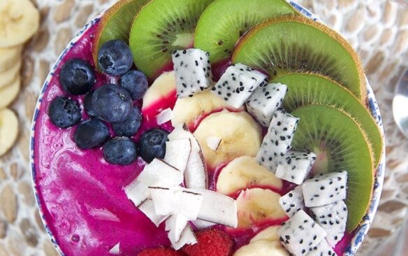 pitaya smoothie bowl with toppings.