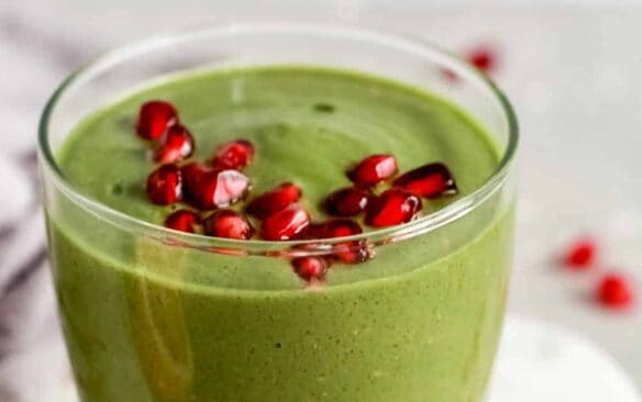 pomegranate green smoothie in a glass.