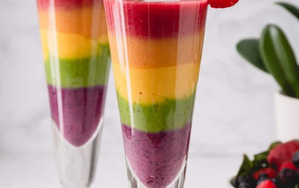 rainbow smoothie in a tall glass.