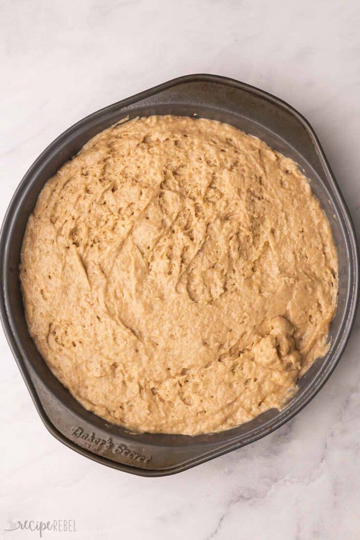 cake batter added to cake pan.