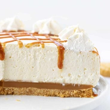 no bake caramel cheesecake on a white plate.