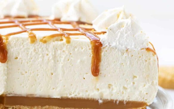 no bake caramel cheesecake on a white plate.