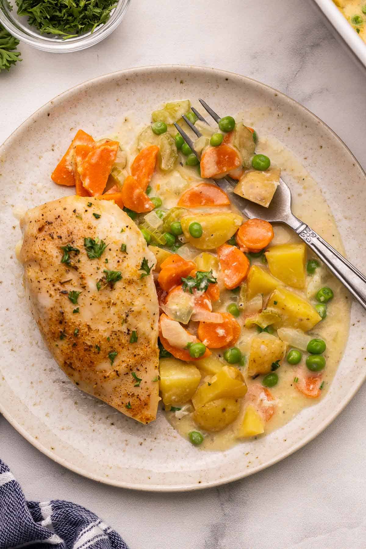 a plate full of chicken casserole and a fork.