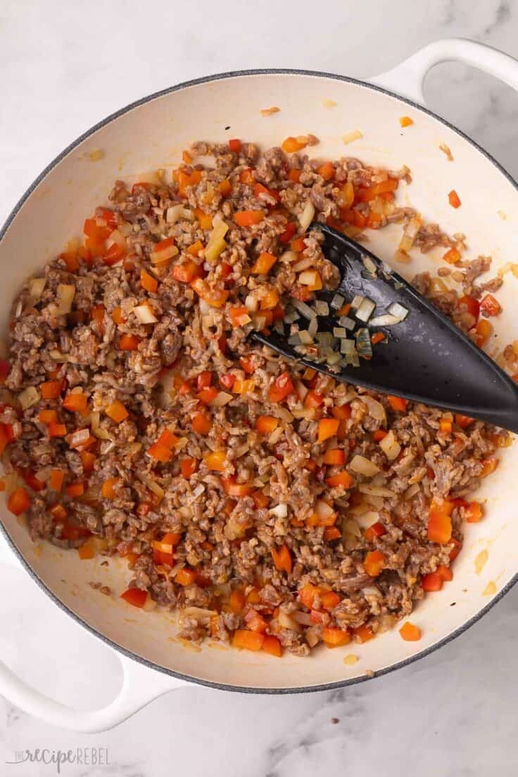 cooked italian sausage and other ingredients in pan.