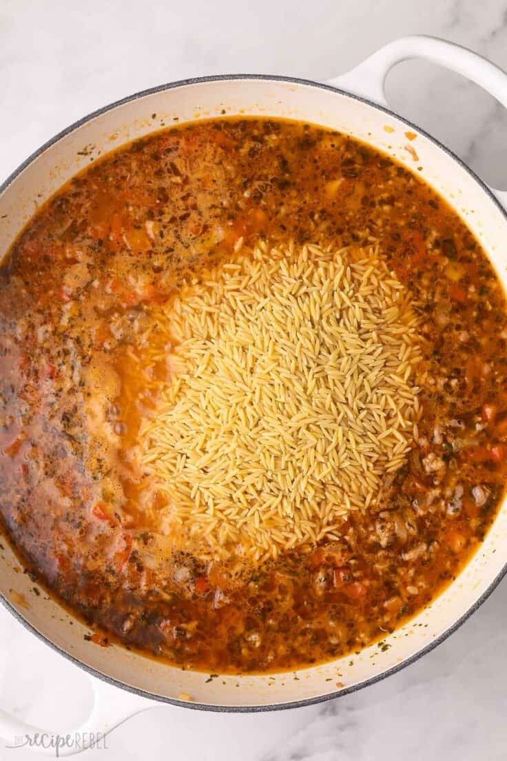 orzo added to other ingredients in large skillet.