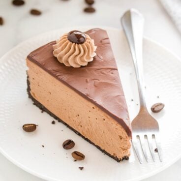 no bake chocolate coffee cheesecake on a white plate.