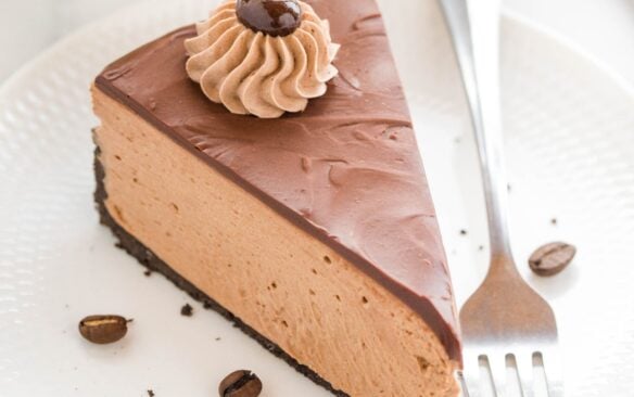 no bake chocolate coffee cheesecake on a white plate.