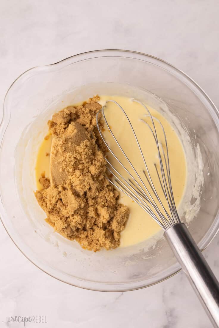 brown sugar added to glass mixing bowl and other ingredients.