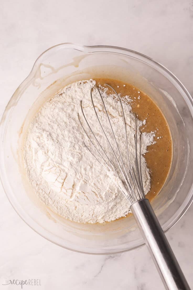 flour added to wet ingredients in mixing bowl.