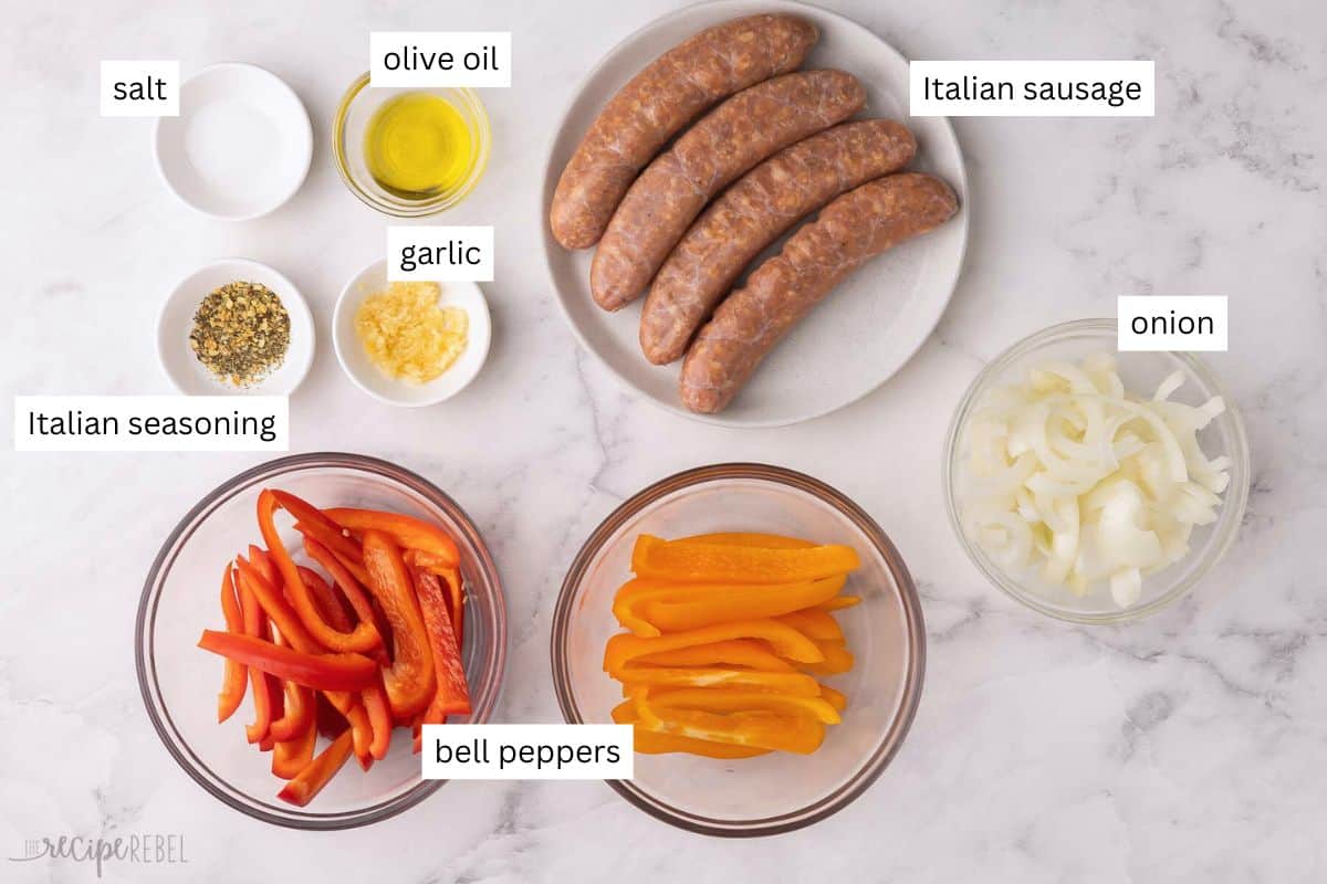 ingredients needed for sausage and peppers in bowls and plate.