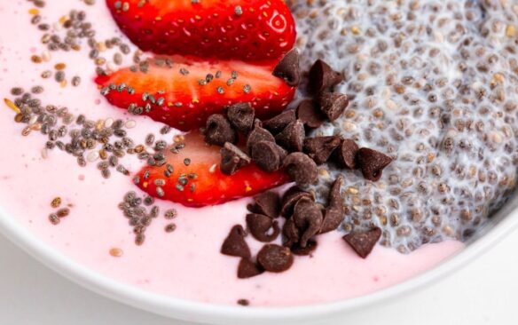 strawberry chia smoothie bowl with toppings.