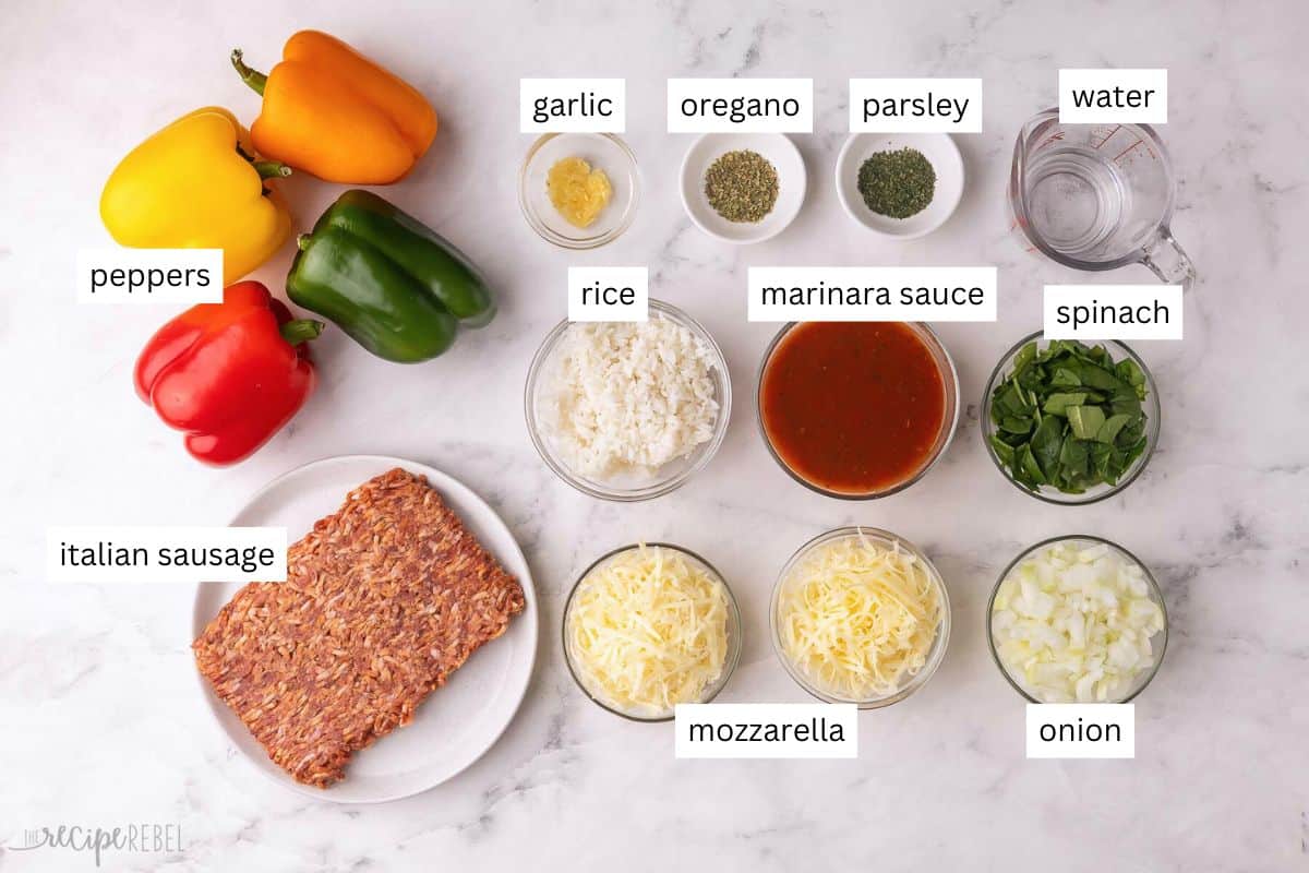 Stuffed Peppers are made with savory Italian sausage, tomato sauce, and rice mixture stuffed into sweet bell peppers, topped with cheese, and cooked in the oven. They're ready in under an hour and great for meal prep! #dinner #recipe | healthy dinner | dinner ideas | dinner recipes | italian sausage | bell peppers | make ahead dinner | meal prep ingredients needed for stuffed peppers in bowls and plate.