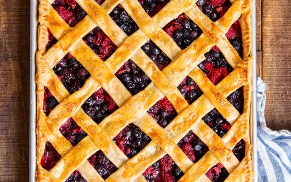 berry rhubarb slab pie in a baking dish.