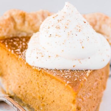 slice of pumpkin pie on a decorative plate.