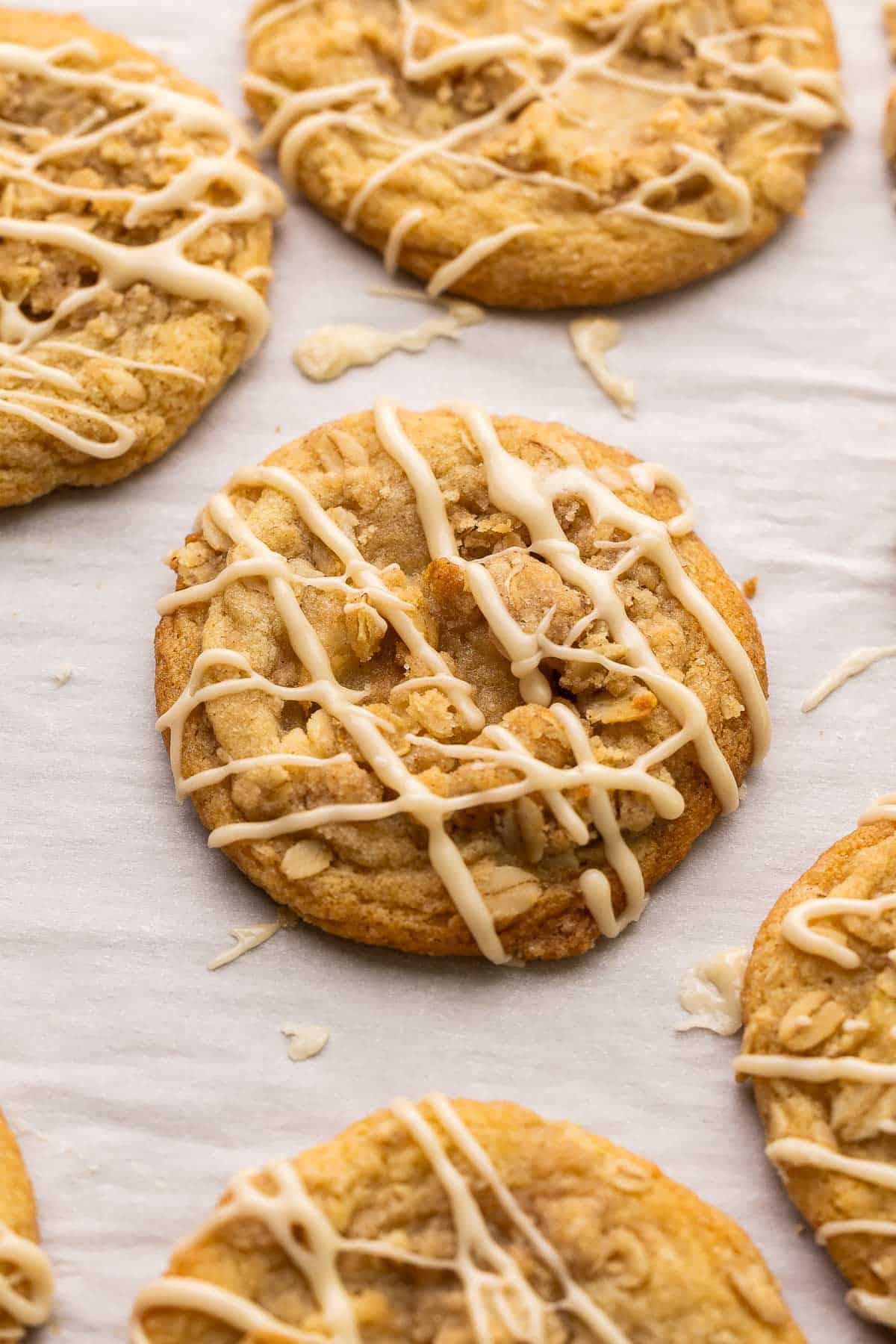 close up image of apple cookie with streusel and maple glaze.