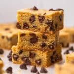 three chocolate chip cookie bars stacked on top of each other.