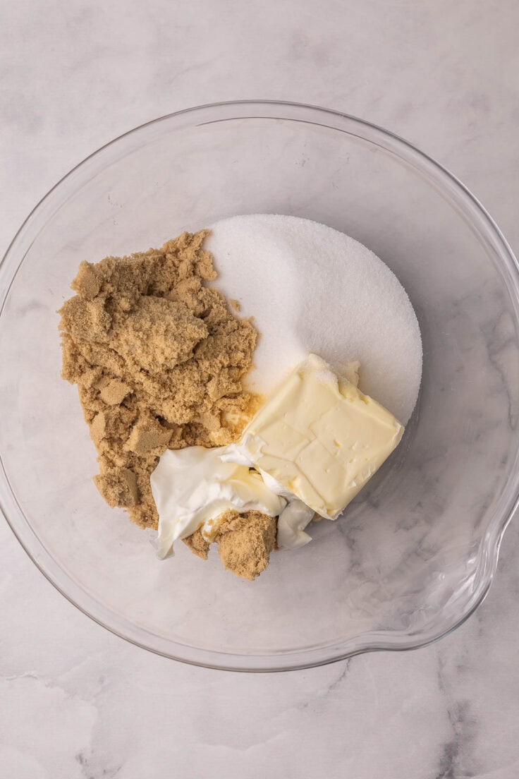 butter and to sugar and other ingredients in glass bowl.