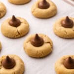 close up of peanut butter blossoms in pan.