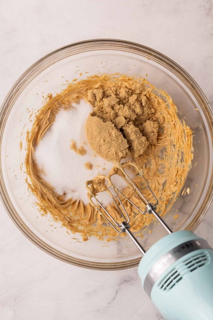 sugar added to other ingredients in glass mixing bowl.