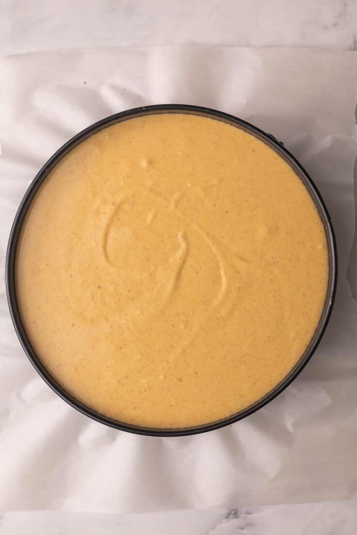 pumpkin cheesecake in pan ready to chill.