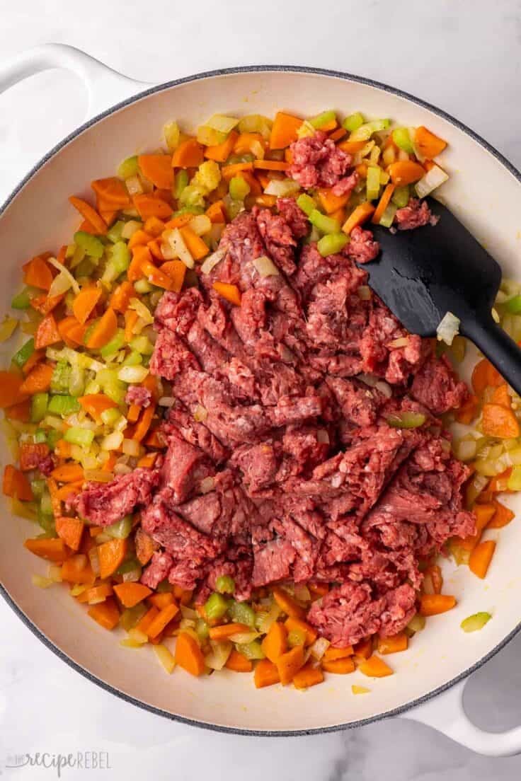 ground beef added to skillet of sauteed vegetables.