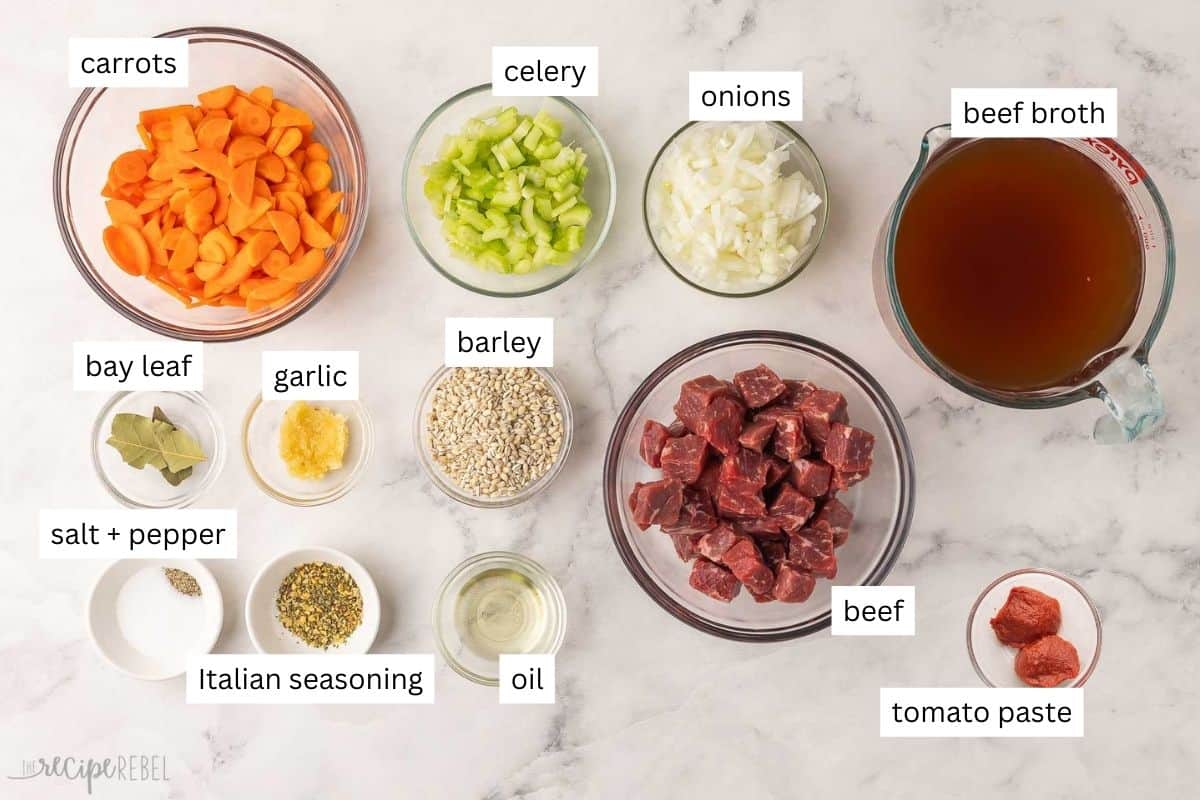 ingredients needed for slow cooker beef barley soup in bowls.