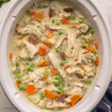 slow cooker filled with garlic parmesan chicken stew.