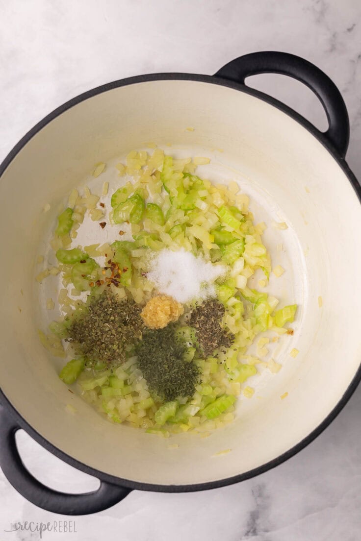 chopped vegetables and spices added to large pot.