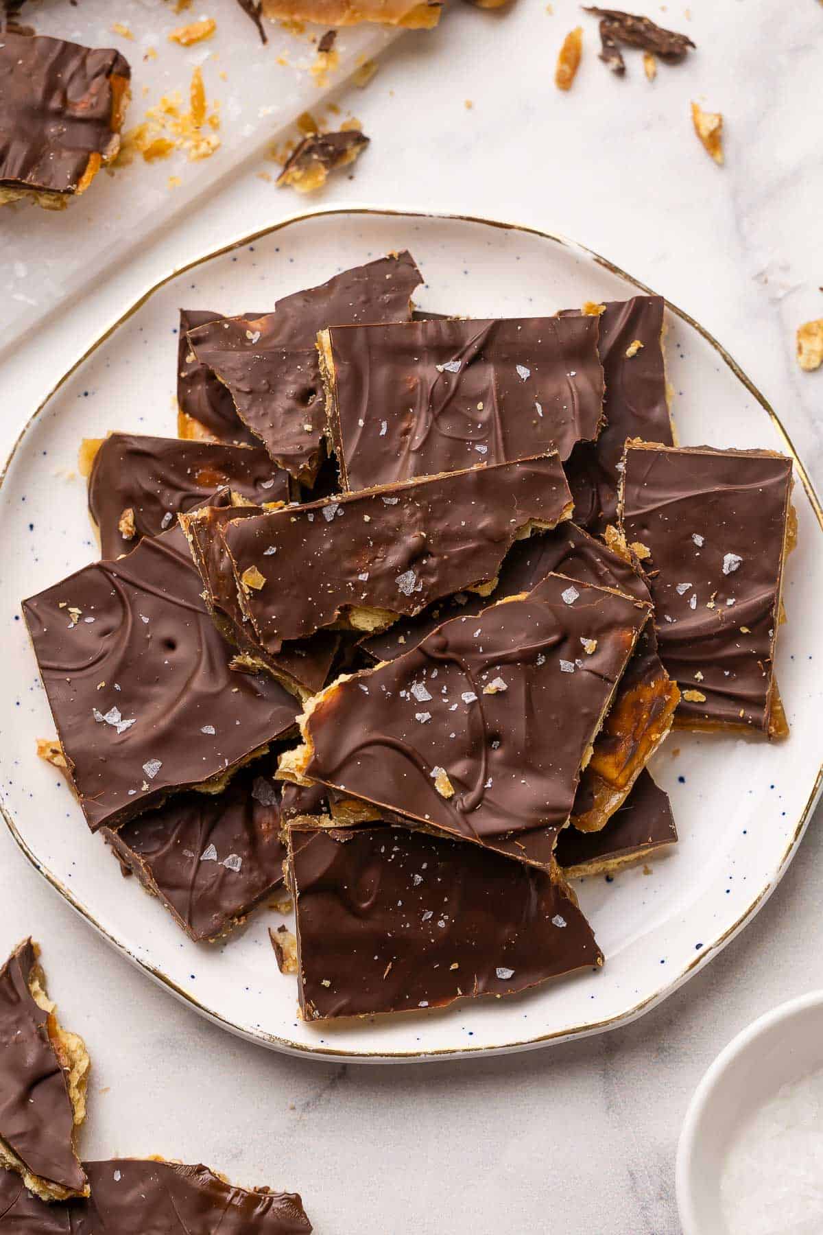 a speckled plate filled with Christmas crack.