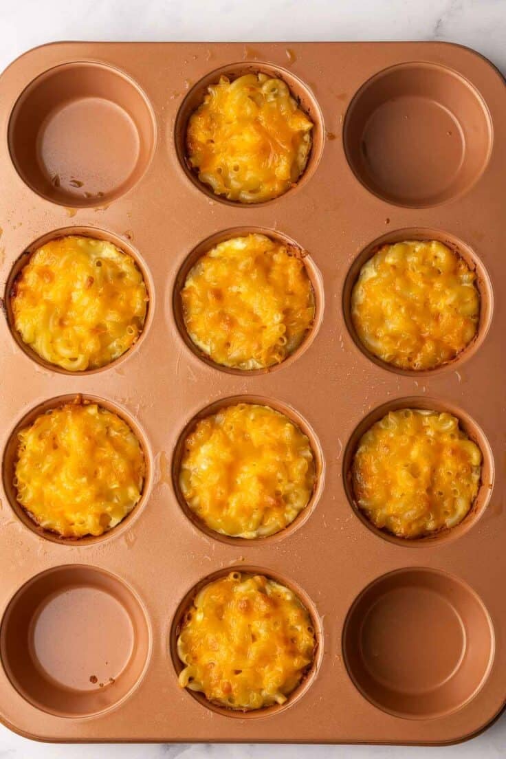 baked mac and cheese cups still in pan.