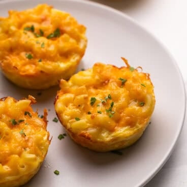 mac and cheese cups on a grey plate.