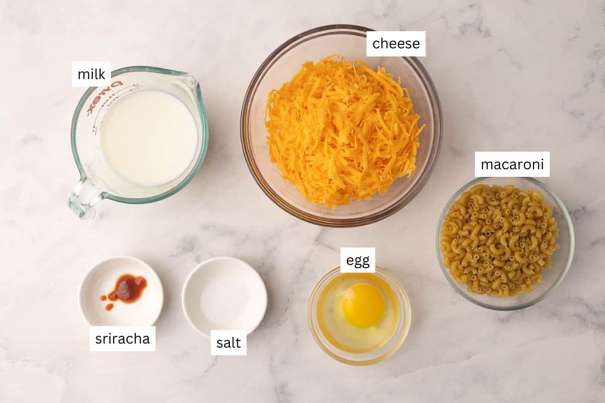 ingredients needed for baked mac and cheese cups in bowls.