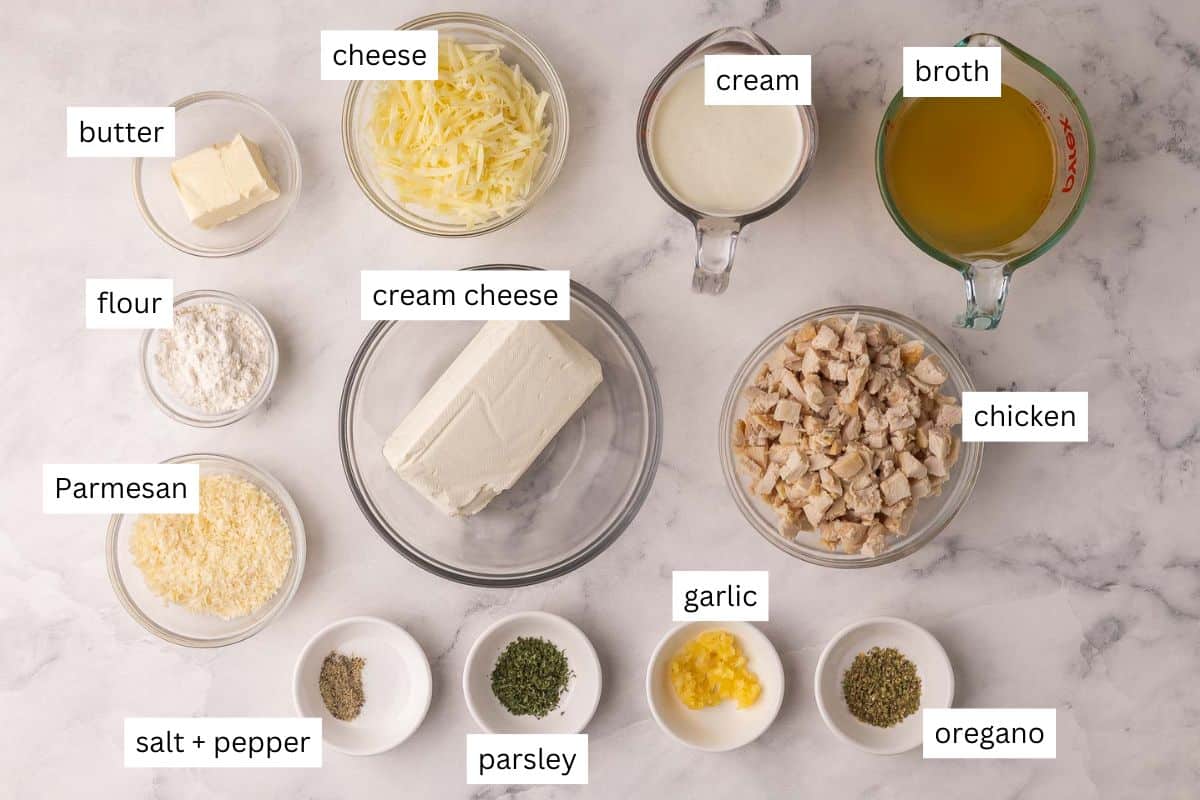 ingredients needed for chicken alfredo dip in bowls.