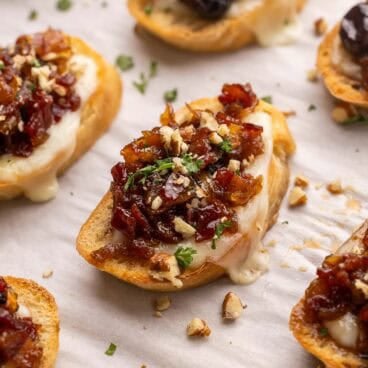 cranberry bacon jam crostini on pan.
