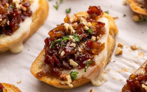 cranberry bacon jam crostini on pan.