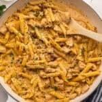 marry me chicken pasta in skillet topped with shredded parmesan cheese.