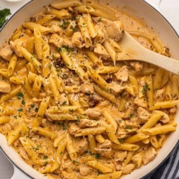 marry me chicken pasta in skillet topped with shredded parmesan cheese.