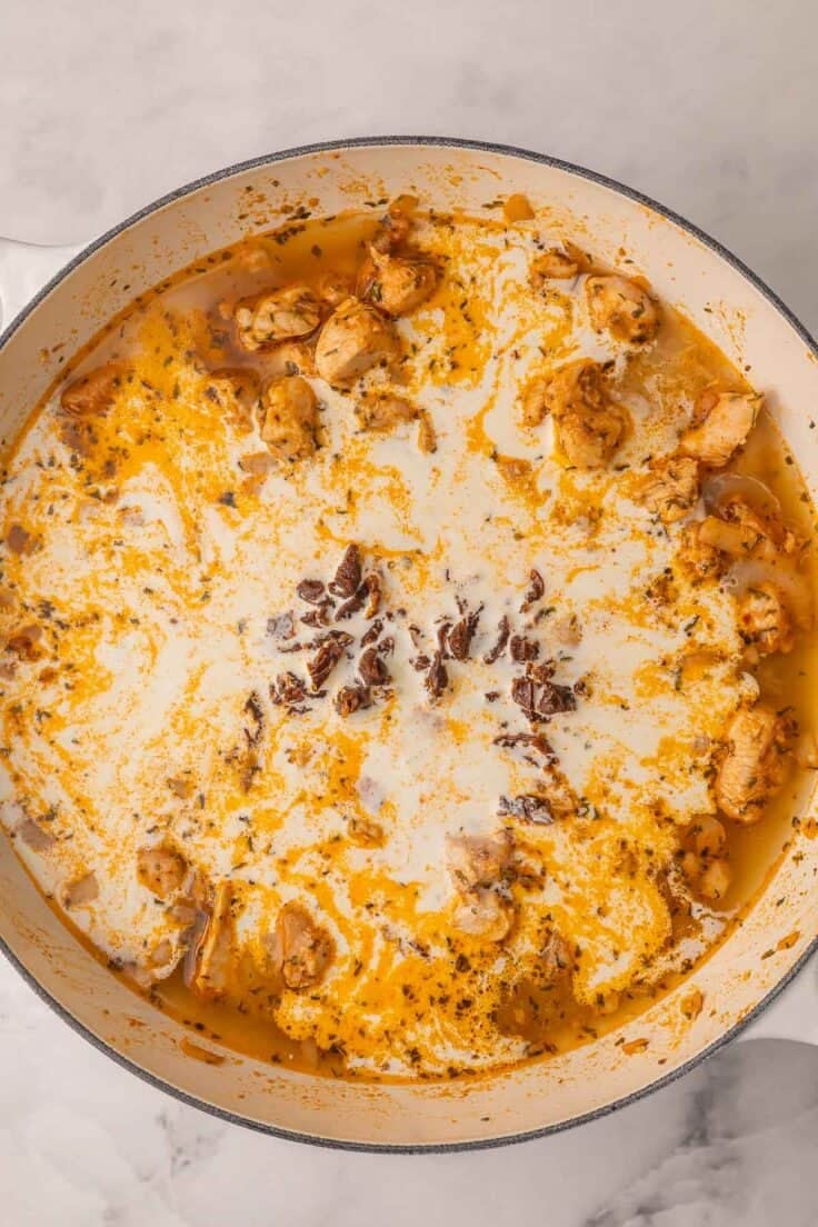 white dish with cream added to other ingredients.