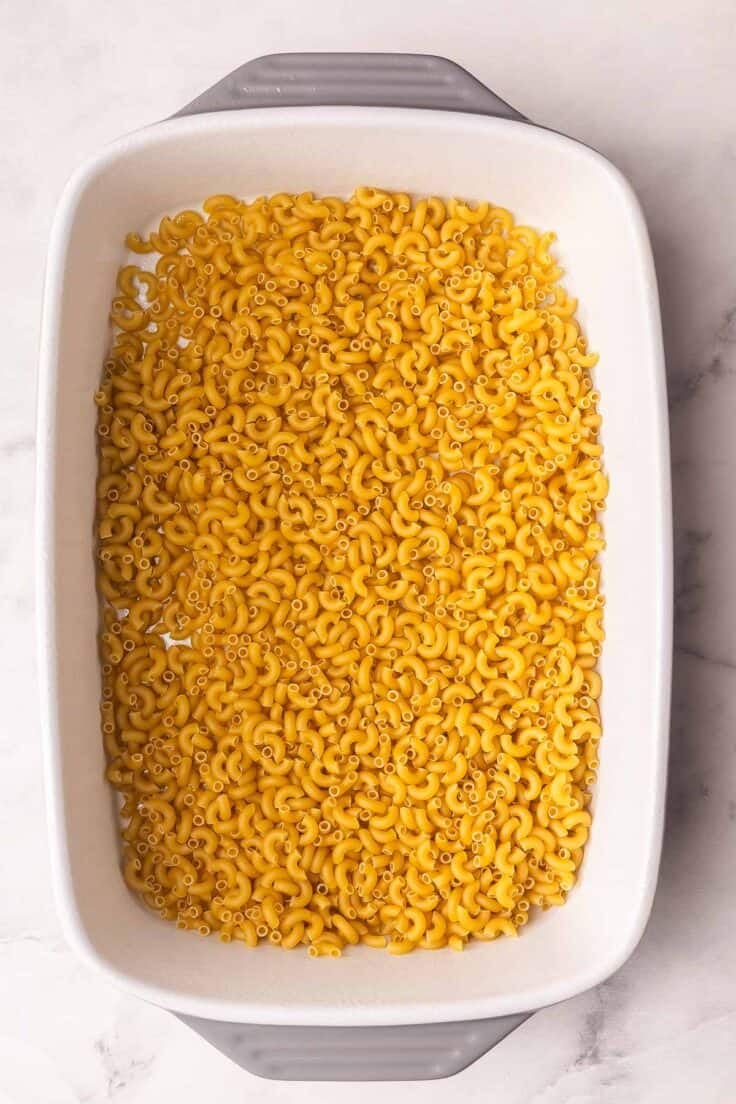 large dish filled with uncooked macaroni.