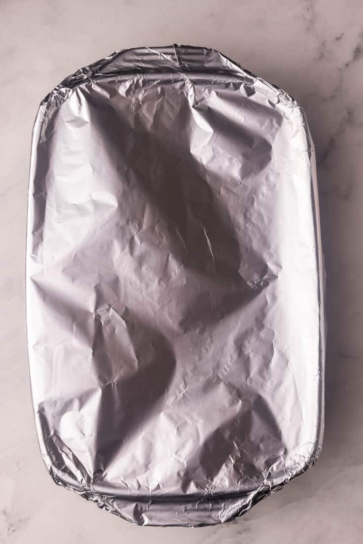 a baking dish covered in foil.