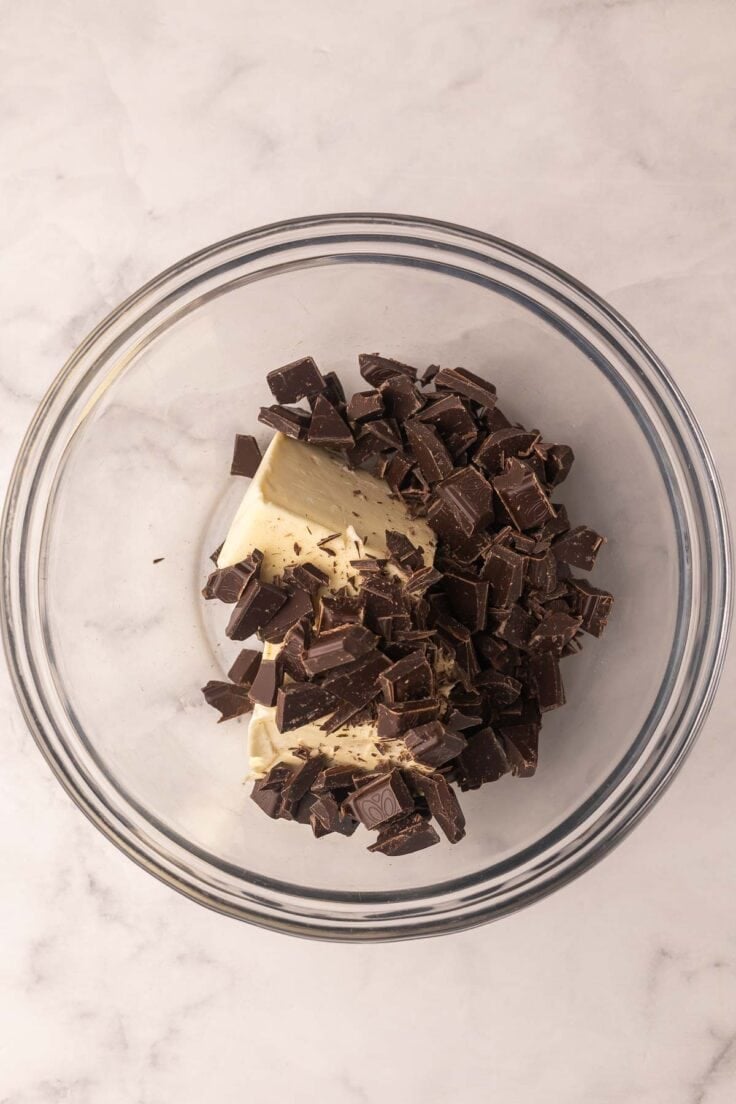 chopped chocolate and butter in a glass bowl.