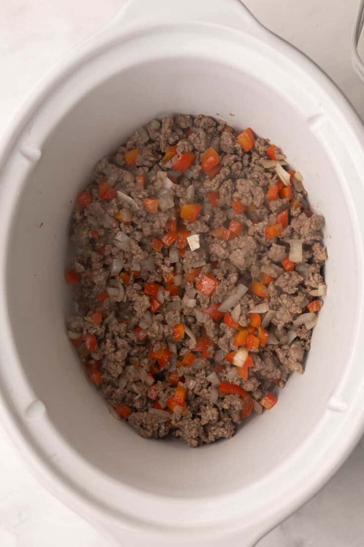 cooked ground beef and vegetables in slow cooker.