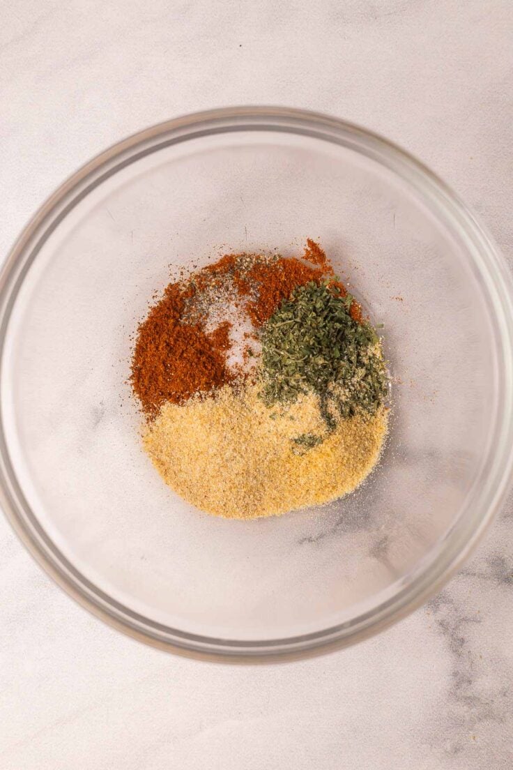 spices in a glass bowl for lemon chicken.