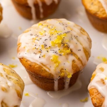 square image of lemon poppy seed muffin with glaze.
