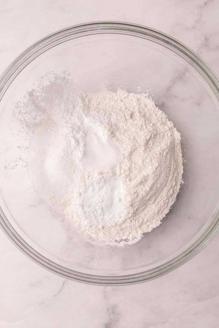 dry ingredients for lemon ricotta pancakes in a glass bowl.