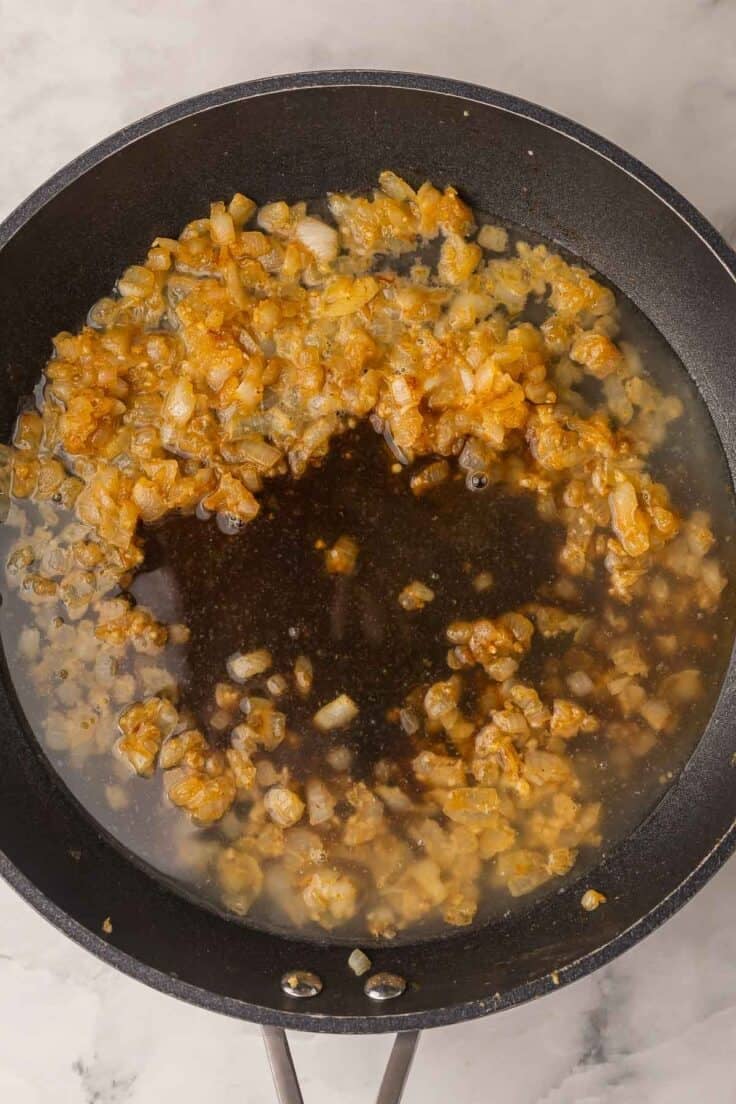 liquids added to onions in skillet to make gravy.