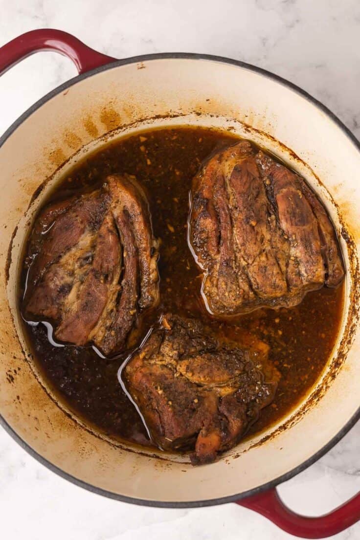 pork cooked in dutch oven ready to shred.