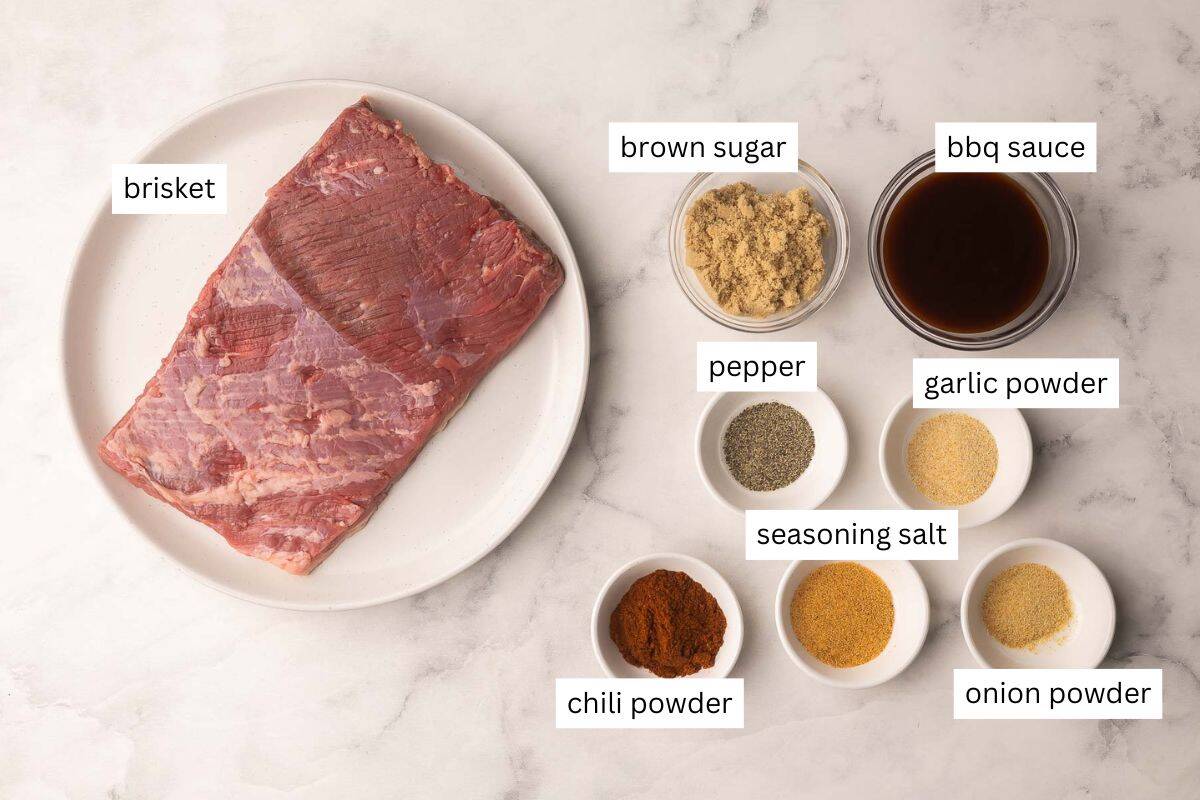 This Slow Cooker Beef Brisket is tender, juicy, and packed with sweet and smoky flavor from a homemade spice rub. It’s the easiest way to make fall-apart brisket right at home without a smoker or grill! #beef #recipe #dinner | barbecue beef | bbq | beef recipes | slow cooker recipes | crockpot meals ingredients needed for slow cooker beef brisket in bowls and plate.