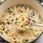 square image of a ladle of tuscan chicken noodle soup coming out of the pot.